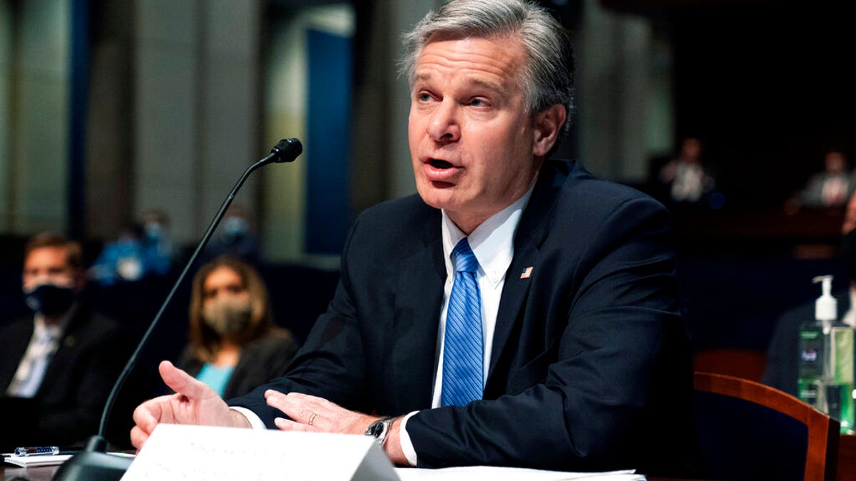 FBI Director Wray photographed testifying during House hearing