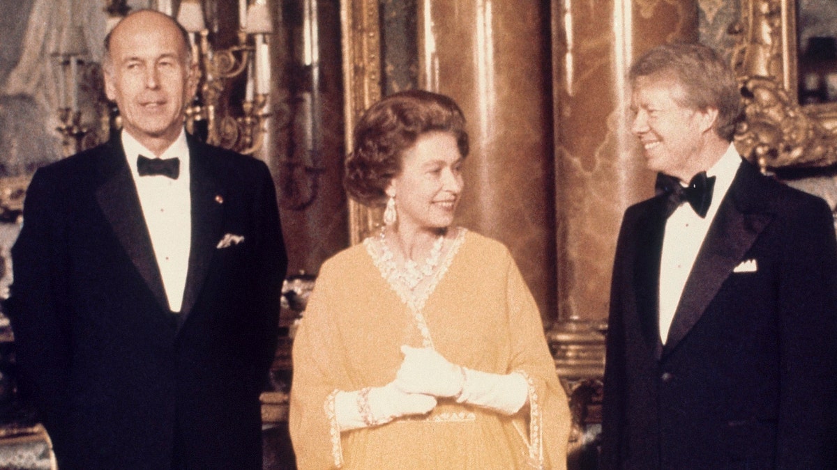 In this file photo dated May 1977, U.S. President Jimmy Carter, right, and Queen Elizabeth II stand with French President Valery Giscard d'Estaing at Buckingham Palace in London. (AP Photo, File)