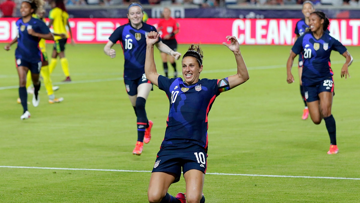 U.S. forward Carli Lloyd slides on the turf after scoring in the first minute against Jamaica during the first half of their 2021 WNT Summer Series soccer match, Sunday, June 13, 2021, in Houston. (