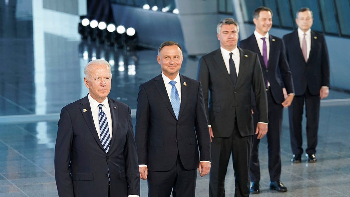 President Joe Biden and other NATO heads of the states and governments pose for a family photo during the NATO summit