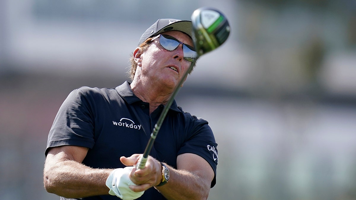 Phil Mickelson watching his tee changeable connected the 12th spread astatine Torrey Pines Golf Course