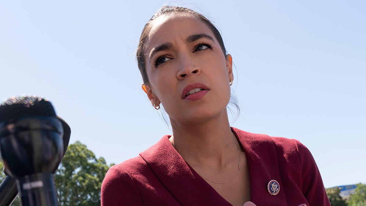 AOC in red jacket