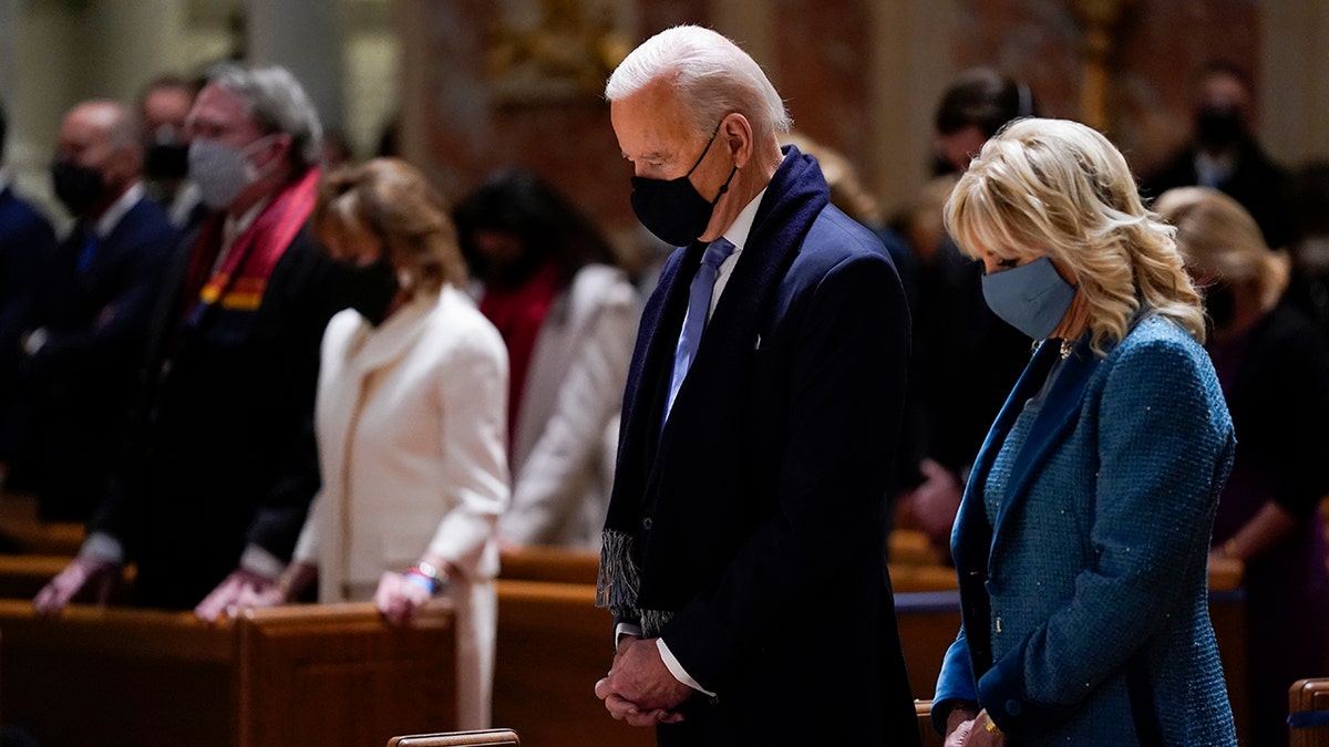 FILE - In this Wednesday, Jan. 20, 2021 file photo, President-elect Joe Biden and his wife, Jill Biden, attend Mass at the Cathedral of St. Matthew the Apostle during Inauguration Day ceremonies in Washington. When U.S. Catholic bishops hold their next national meeting in June 2021, they’ll be deciding whether to send a tougher-than-ever message to President Joe Biden and other Catholic politicians: Don’t partake of Communion if you persist in public advocacy of abortion rights. (AP Photo/Evan Vucci, File)