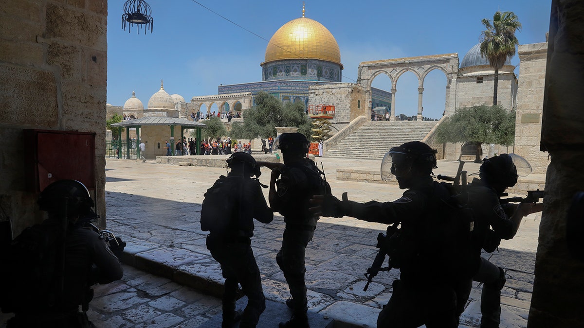 Israeli security forces take positions during clashes with Palestinians in front of the Dome of the Rock Mosque at the Al Aqsa Mosque compound in Jerusalem's Old City on June 18, 2021. (AP Photo/Mahmoud Illean, File)