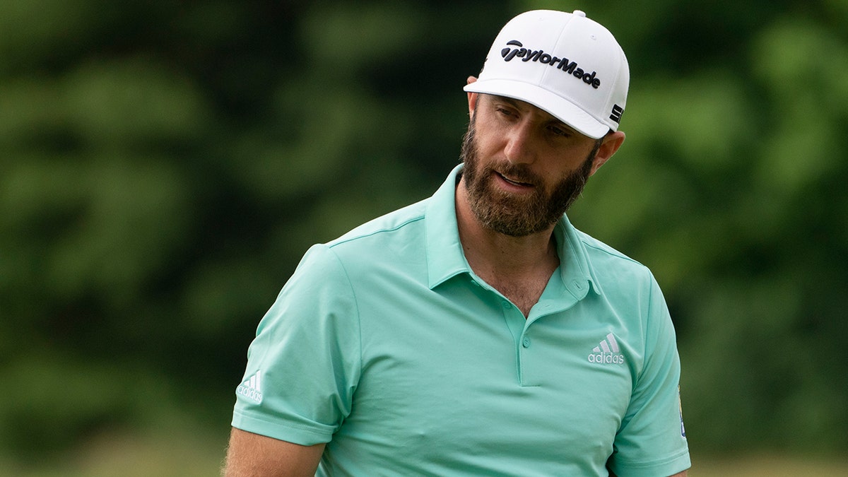 Dustin Johnson reacts to a missed put on the fourth green during the third round of the Travelers Championship golf tournament at TPC River Highlands, Saturday, June 26, 2021, in Cromwell, Conn. (AP Photo/John Minchillo)