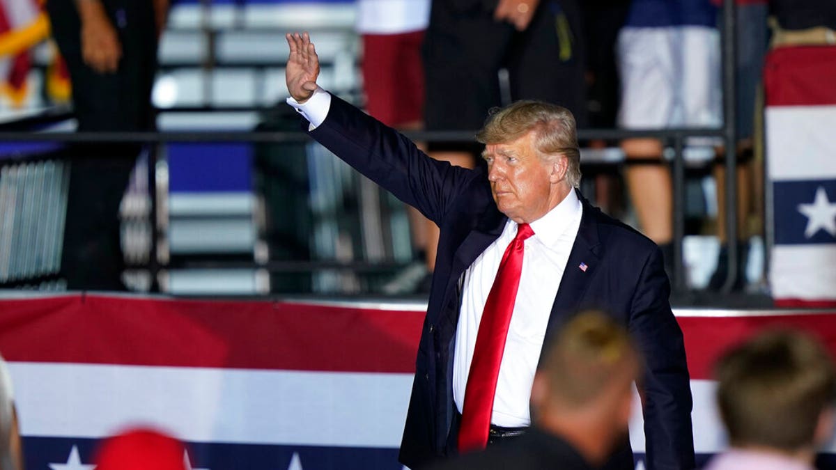 Former President Trump waves to supporters as he leaves the stage after speaking at a rally at the Lorain County Fairgrounds, Saturday, June 26, 2021, in Wellington, Ohio. (AP Photo/Tony Dejak)