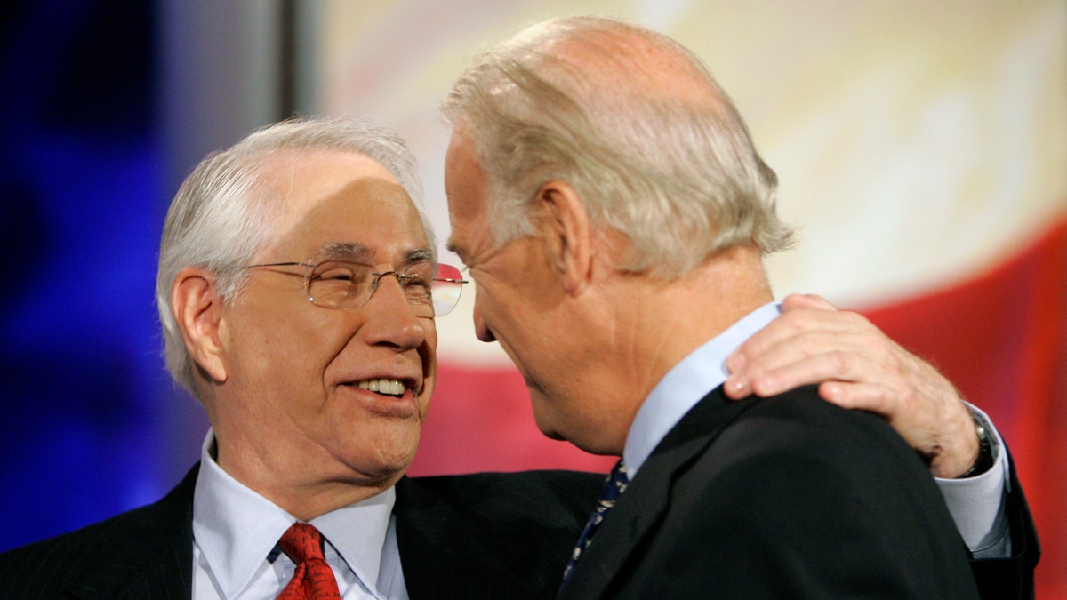 FILE - Democratic presidential hopefuls former Alaska Sen. Mike Gravel, left, and Sen. Joe Biden, D-Del., talk on stage during a break in the ABC News Democratic candidates debate at Drake University in Des Moines, Iowa, in this Sunday, Aug. 19, 2007, file photo. Gravel, a former U.S. senator from Alaska who read the Pentagon Papers into the Congressional Record and confronted Barack Obama about nuclear weapons during a later presidential run, has died. He was 91. Gravel, who represented Alaska as a Democrat in the Senate from 1969 to 1981, died Saturday, June 26, 2021. Gravel had been living in Seaside, California, and was in failing health, said Theodore W. Johnson, a former aide. (AP Photo/Charlie Neibergall, File)