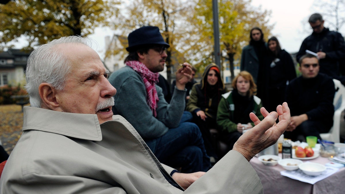 FILE - Former Democratic U.S. senator Mike Gravel gestures while talking to "Occupy" activists at Lindenhof square in Zurich, Switzerland, in this Monday, Oct. 31, 2011, file photo. Gravel, a former U.S. senator from Alaska who read the Pentagon Papers into the Congressional Record and confronted Barack Obama about nuclear weapons during a later presidential run, has died. He was 91. Gravel, who represented Alaska as a Democrat in the Senate from 1969 to 1981, died Saturday, June 26, 2021. Gravel had been living in Seaside, California, and was in failing health, said Theodore W. Johnson, a former aide. (AP Photo/Keystone, Steffen Schmidt, File)