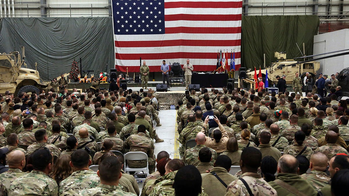FILE - In this Dec. 24, 2017 file photo, Gen. Joseph Dunford, chairman of the Joint Chiefs of Staff speaks during a ceremony on Christmas Eve at Bagram Air Base, in Afghanistan. In 2001 the armies of the world united behind America and Bagram Air Base, barely an hours drive from the Afghan capital Kabul, was chosen as the epicenter of Operation Enduring Freedom, as the assault on the Taliban rulers was dubbed. It’s now nearly 20 years later and the last US soldier is soon to depart the base. (AP Photo/Rahmat Gul, File)
