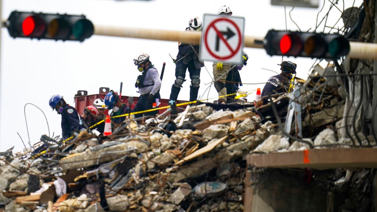 Crews work in the rubble of Champlain Towers South residential condo, Tuesday, June 29, 2021, in Surfside, Fla. Many people were still unaccounted for after Thursday's fatal collapse. (AP Photo/Gerald Herbert)