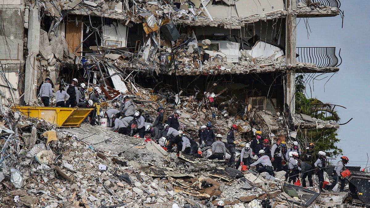 Search and rescue teams look for survivors at the Champlain Towers South residential condo, Tuesday, June 29, 2021, in Surfside, Fla. Many people were still unaccounted for after Thursday's fatal collapse. (Al Diaz/Miami Herald via AP)