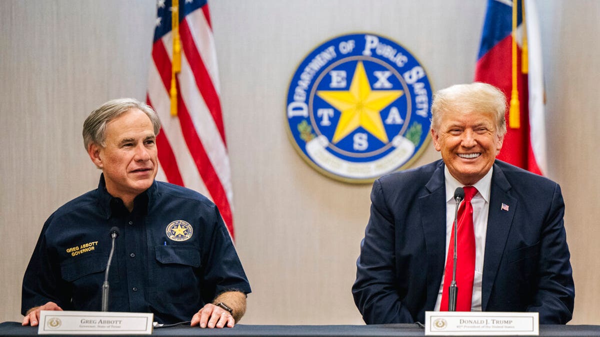 Texas Gov. Greg Abbott addresses former President Donald Trump during a border security briefing to discuss further plans in securing the southern border wall on Wednesday, June 30, 2021, in Weslaco, Texas. (Brandon Bell/Pool via AP)