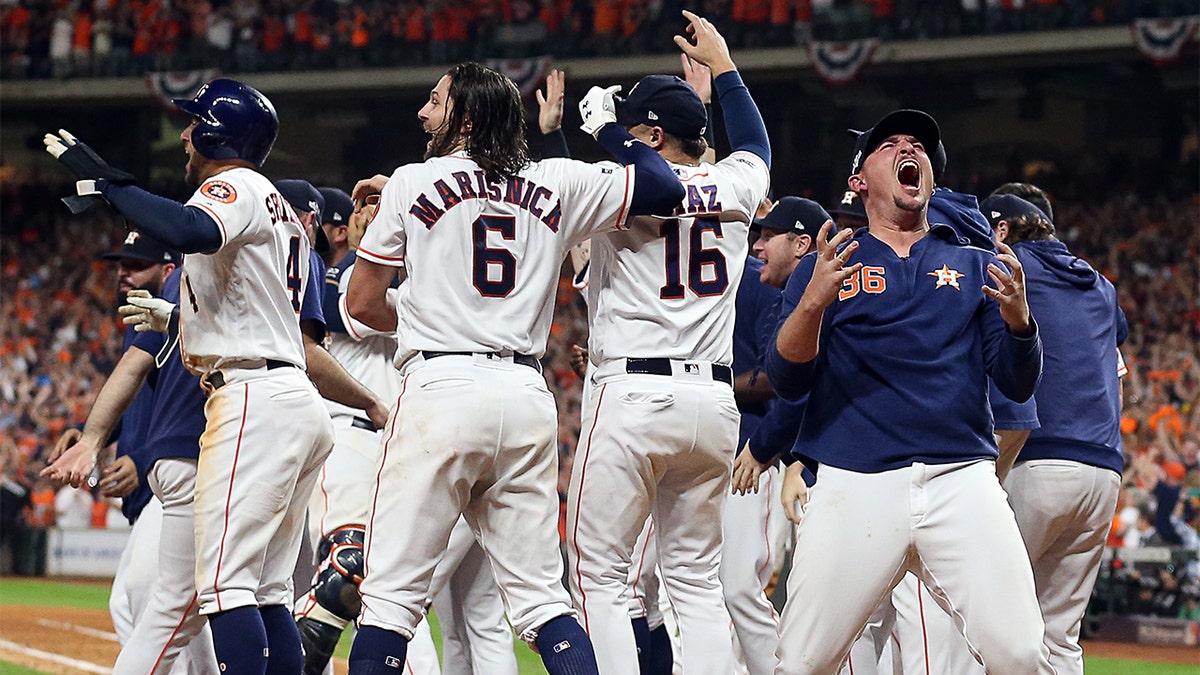 Will Harris #36 of the Houston Astros celebrates with this teammates after winning the ALCS Championship against the New York Yankees in Game 6 of the American League Championship Series at Minute Maid Park on October 19, 2019 in Houston, Texas. (Photo by Bob Levey/Getty Images)