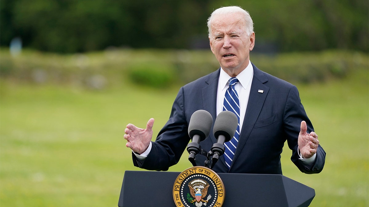 President Biden speaks at a podium.