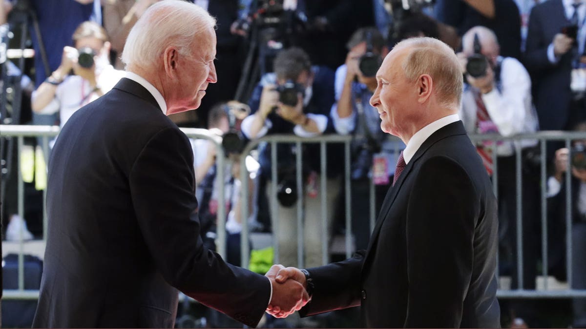 Biden and Putin shake hands in Geneva