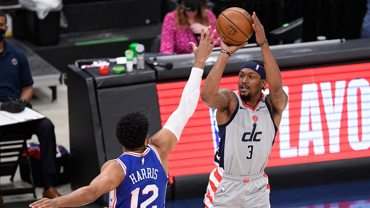Washington Wizards guard Bradley Beal (3) shoots against Philadelphia 76ers forward Tobias Harris (12) during the first half of Game 4 in a first-round NBA basketball playoff series, Monday, May 31, 2021, in Washington. (AP Photo/Nick Wass)