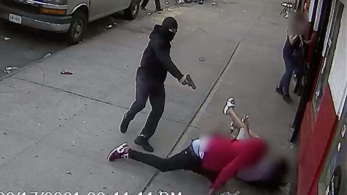 A suspect shoots a man in broad daylight in the Bronx, inches away from two terrified children. (NYPD)