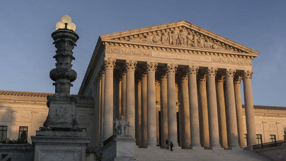 In this Nov. 6, 2020, file photo, the Supreme Court is seen at sundown in Washington. 