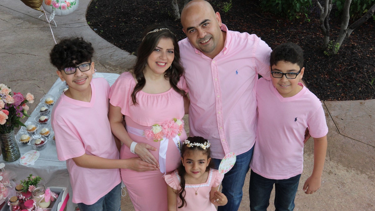 Rima Aldebbeh told Fox News that when she found out she was pregnant with twins, she was overwhelmed because she already has three other children. Aldebbeh and her family are pictured at a baby shower at the hospital, before the twins were born.