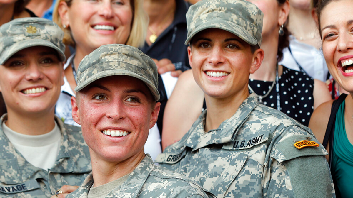 FILE: Army 1st Lt. Shaye Haver, center, and Capt. Kristen Griest, right, pose for photos with other female West Point alumni after an Army Ranger school graduation ceremony at Fort Benning, Ga. Haver and Griest became the first female graduates of the Army's rigorous Ranger School.
