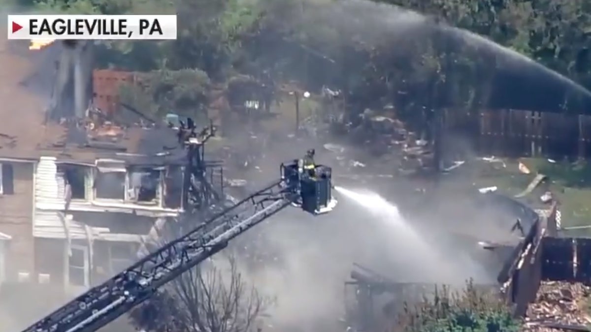 Firefighters fight a three-alarm fire that broke out after a number of explosions at a Pennsylvania apartment complex.