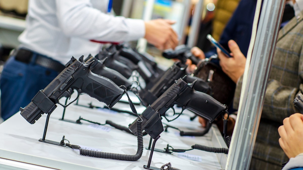 Handguns on display table