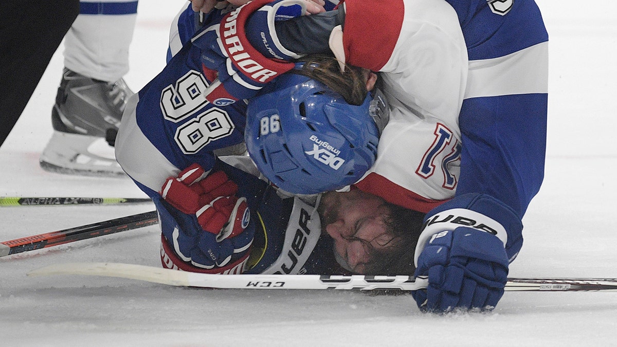 Tampa Bay Lightning defenseman Mikhail Sergachev checks Montreal Canadiens right wing Brendan Gallagher (11) on the ice during the third period in Game 1 of the NHL hockey Stanley Cup finals, Monday, June 28, 2021, in Tampa, Fla. (AP Photo/Phelan Ebenhack)