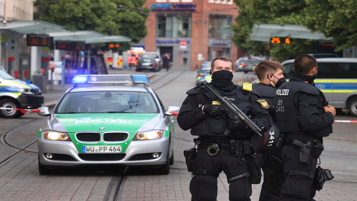 Police cars attend the scene of an incident in Wuerzburg, Germany, Friday June 25, 2021. (Karl-Josef Hildenbrand/dpa via AP)
