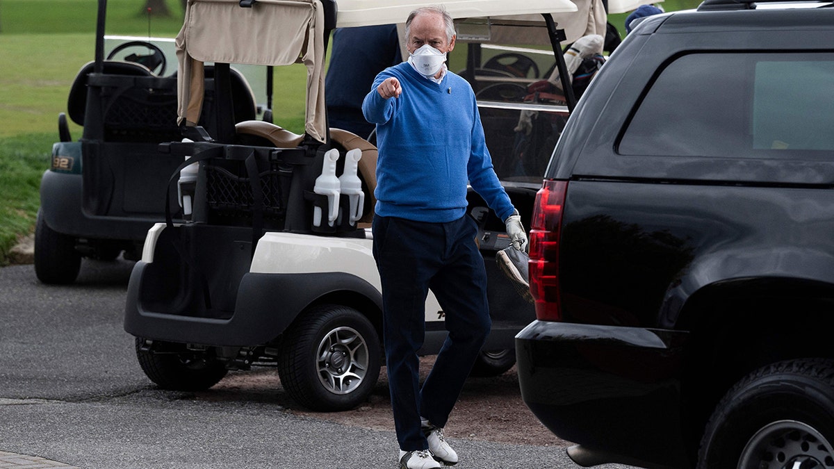 Counselor to the President Steve Ricchetti (C) gestures after playing a round of golf with US President Joe Biden at Wilmington Country Club in Wilmington, Delaware on April 17, 2021.?