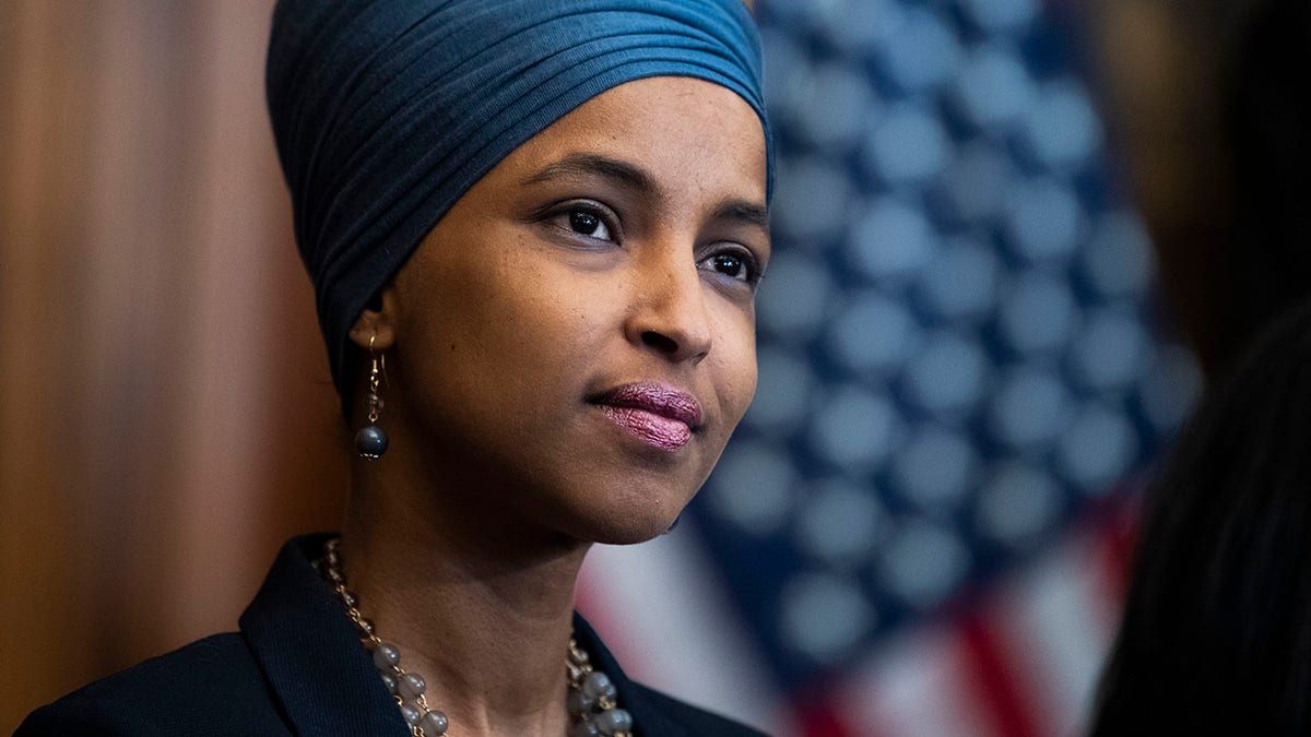 Rep. Ilhan Omar, D-Minn., attends a bill enrollment ceremony for the Juneteenth National Independence Day Act in the Capitol on Thursday, June 17, 2021. 