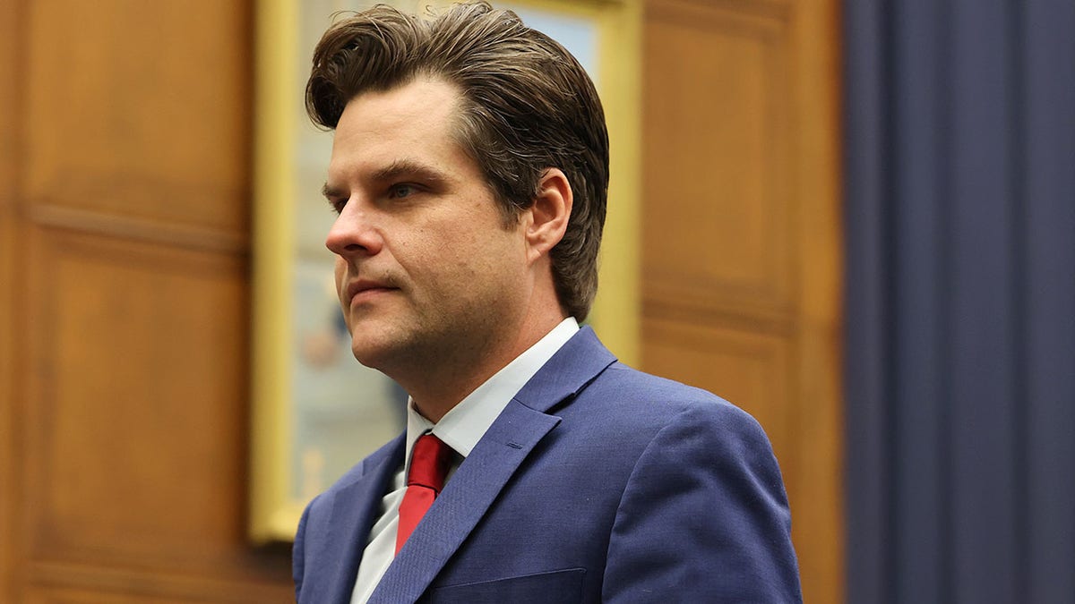 Rep. Matt Gaetz wearing a suit and tie