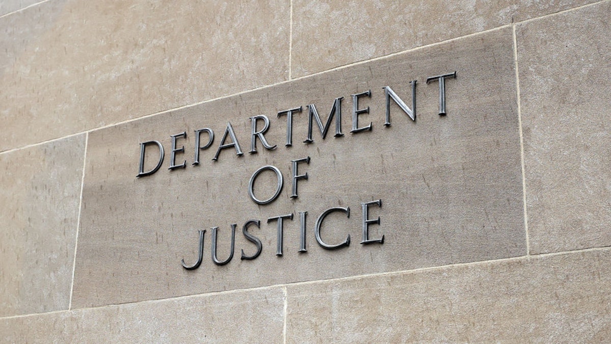 Department of Justice sign on a building