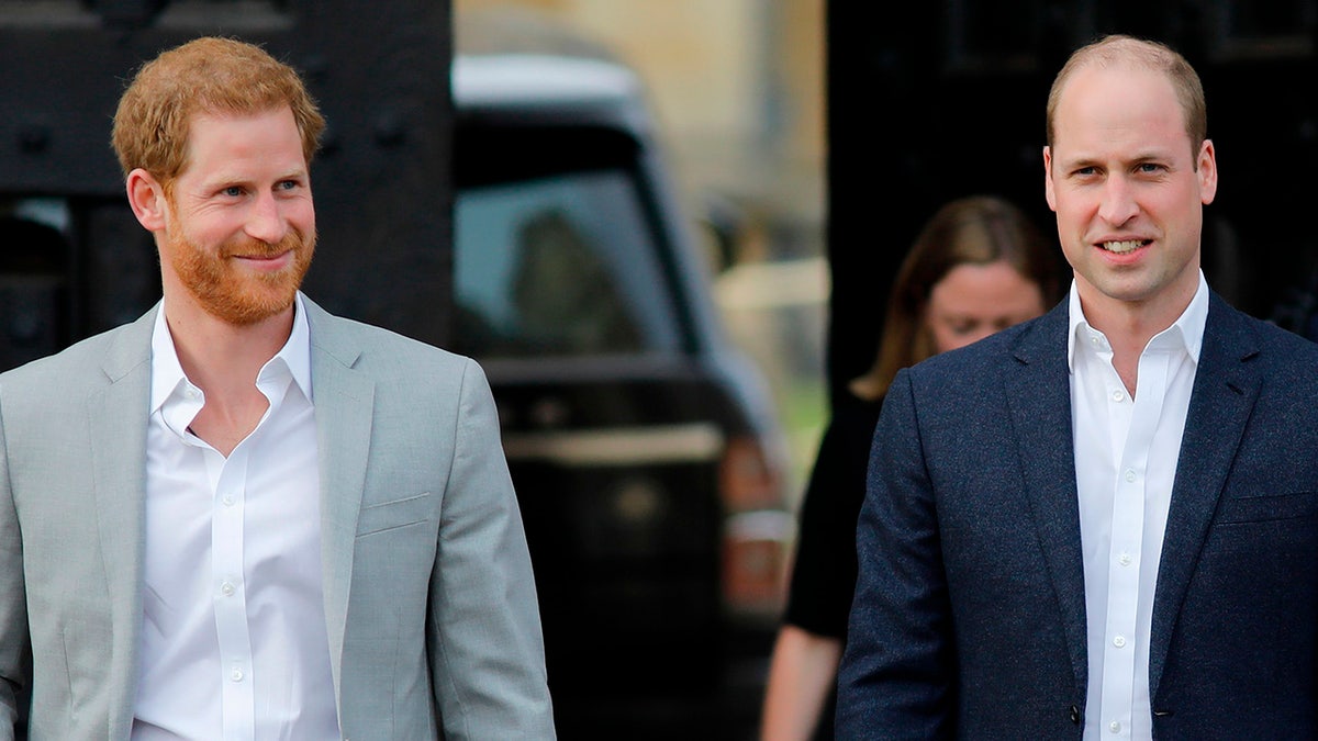Britain's Prince Harry (L) and older brother Prince William will unveil a statue honoring their late mother Princess Diana.