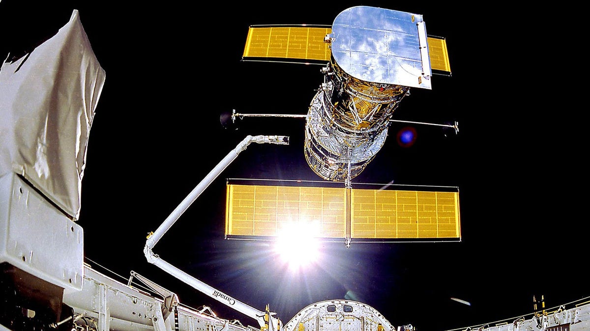 The Hubble Space Telescope is deployed on April 25, 1990, from the space shuttle Discovery.