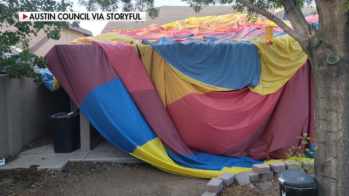 The envelope of the hot air balloon landed in an Albuquerque resident's yard.