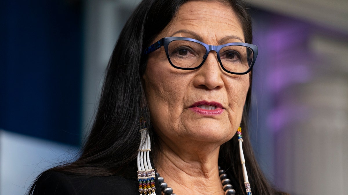 FILE - In this April 23, 2021, file photo, Interior Secretary Deb Haaland speaks during a news briefing at the White House in Washington. On Tuesday, June 22, 2021, Haaland and other federal officials are expected to announce steps that the federal government plans to take to reconcile the legacy of boarding school policies on Indigenous families and communities across the U.S. (AP Photo/Evan Vucci, File)