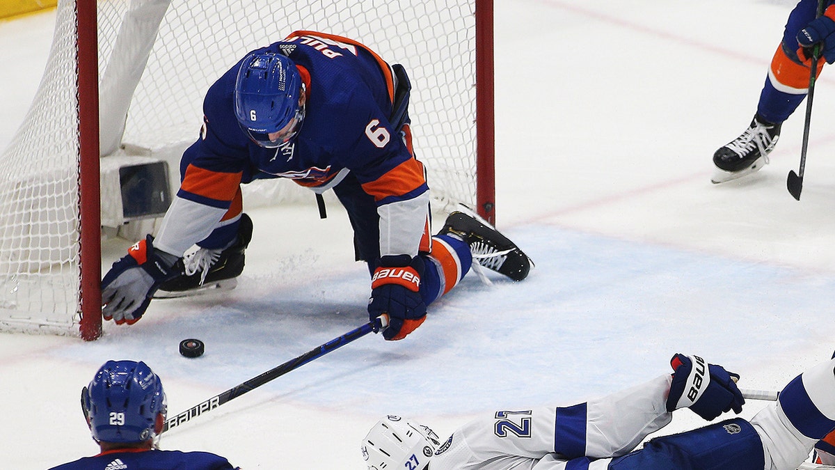 New York Islanders defenseman Ryan Pulock (6) makes a last second save to secure the victory against the Tampa Bay Lightning during the third period of game four of the 2021 Stanley Cup Semifinals at Nassau Veterans Memorial Coliseum, June 19, 2021. (USA TODAY Sports)