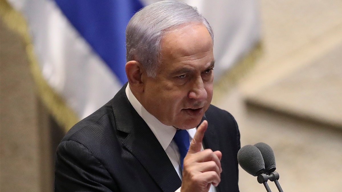 Israel's outgoing prime minister Benjamin Netanyahu speaks during a Knesset session in Jerusalem Sunday, June 13, 2021. (AP Photo/Ariel Schalit)