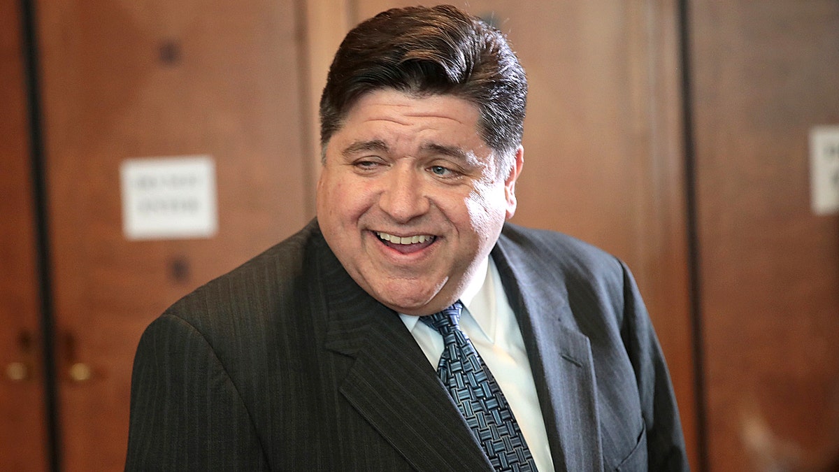 Gov. J.B. Pritzker smiles as he attends fundraiser