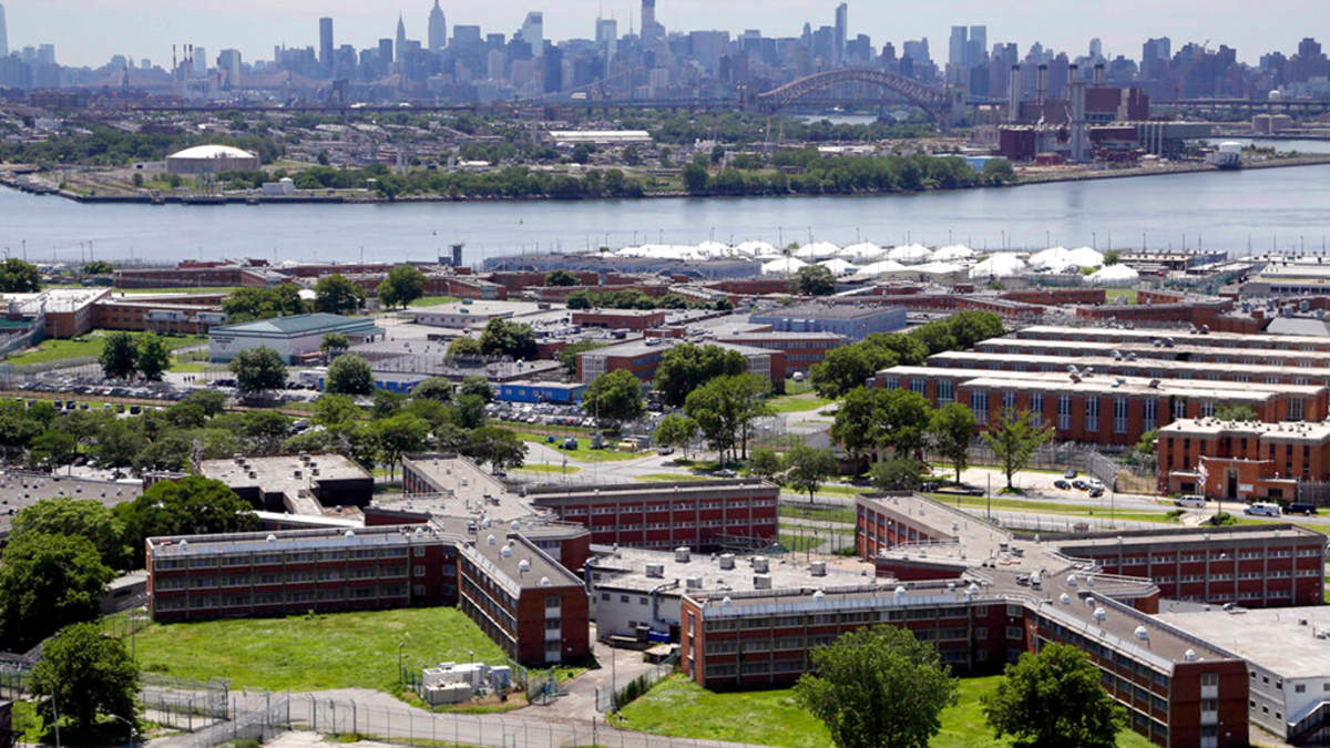 FILE: This June 20, 2014 file photo shows the Rikers Island jail complex in New York, with the Manhattan skyline in the background.?