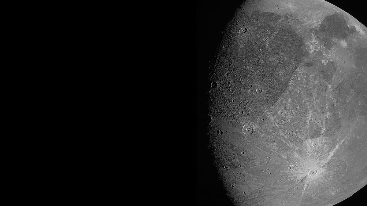 This June 7, 2021 image made available by NASA shows the Jovian moon Ganymede as the Juno spacecraft flies by. "This is the closest any spacecraft has come to this mammoth moon in a generation," said Juno's lead scientist, Scott Bolton of the Southwest Research Institute in San Antonio. (NASA/JPL-Caltech/SwRI/MSSS via AP)