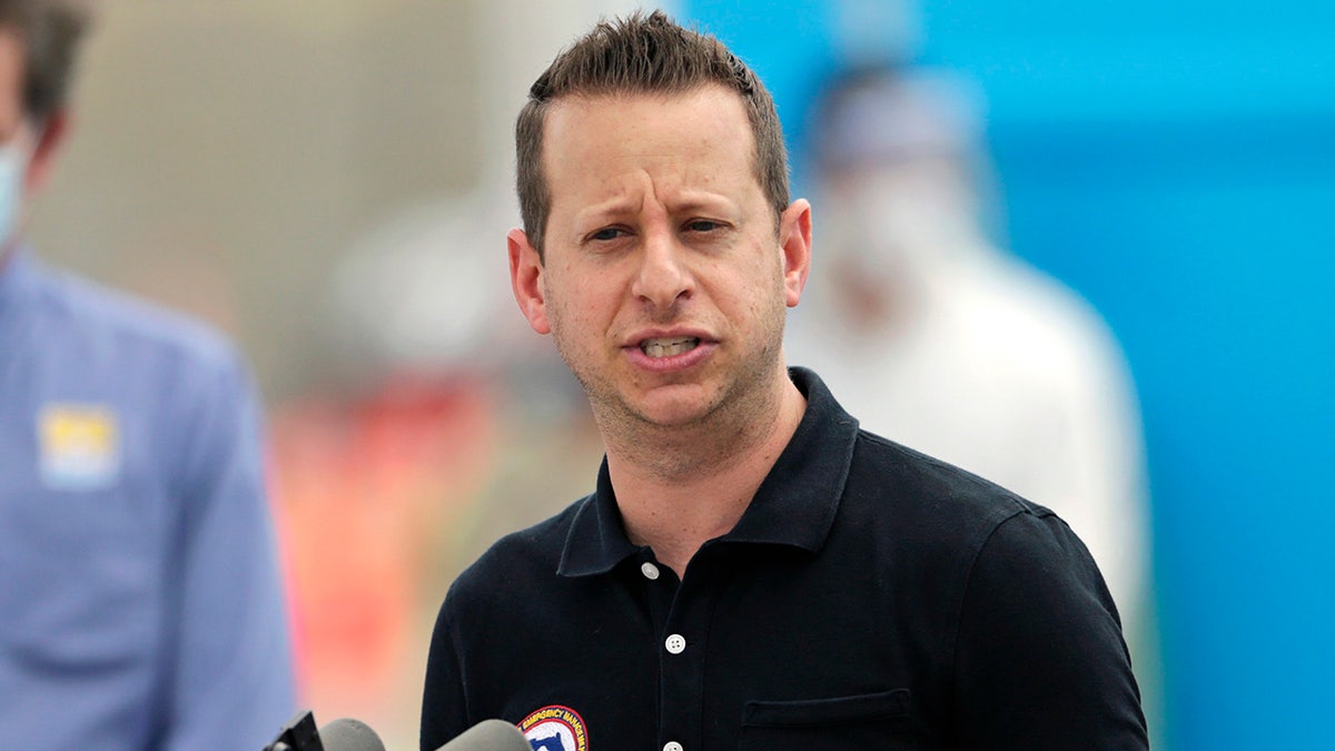 Then-Division of Emergency Management Director Jared Moskowitz talks to the media alongside Florida Governor Ron DeSantis during press conference to announces COVID-19 antibody testing, mobile lab at Hard Rock Stadium as the novel coronavirus pandemic continues on Wednesday, May 6, 2020 in Miami Gardens, Fla. (David Santiago/Miami Herald/Tribune News Service via Getty Images)