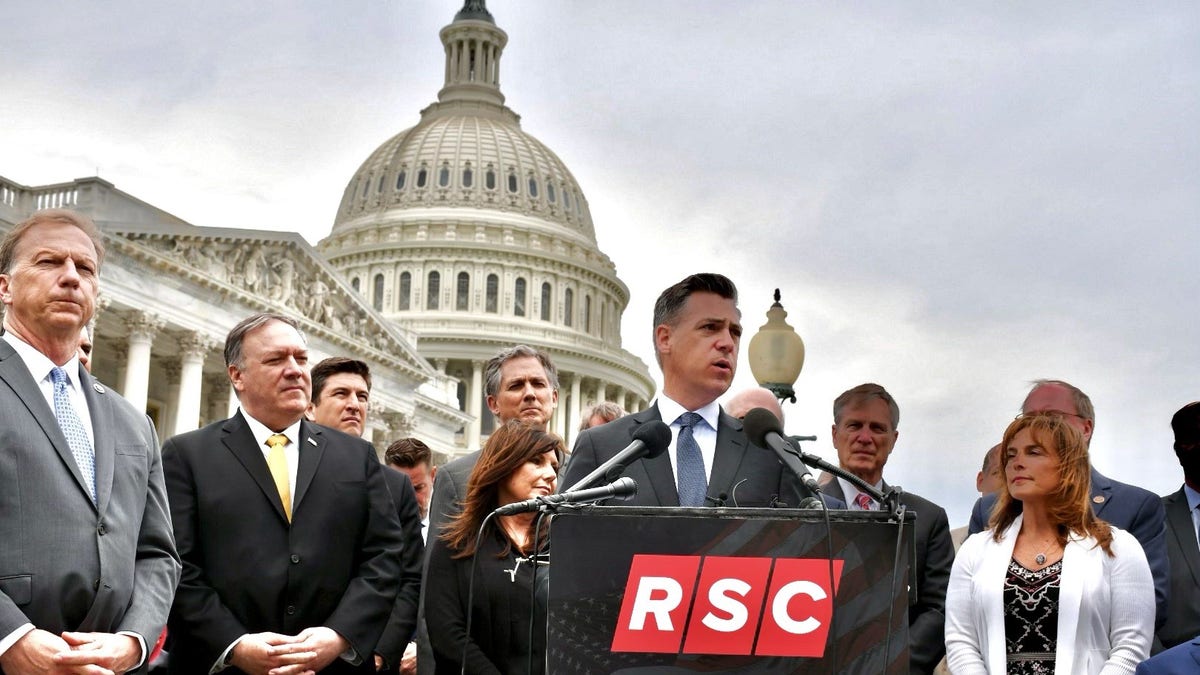 Rep. Jim Banks of Indiana, the chair of the Republican Study Committee, and other members of the conservative caucus, hold a news conference outside the U.S. Capitol, in April of 2021.