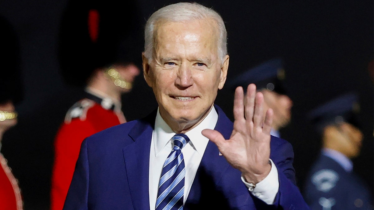 President Joe Biden waves on his arrival on Air Force One at Cornwall Airport Newquay, in Newquay, England, ?ahead of the G-7 summit, Wednesday, June 9, 2021. (Phil Noble/Pool Photo via AP)