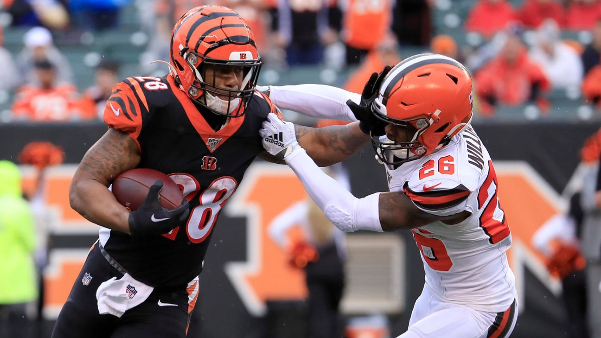 CINCINNATI, OHIO - DECEMBER 29:   Joe Mixon #28 of the Cincinnati Bengals runs with the ball during the game against the Cleveland Browns at Paul Brown Stadium on December 29, 2019 in Cincinnati, Ohio. (Photo by Andy Lyons/Getty Images)
