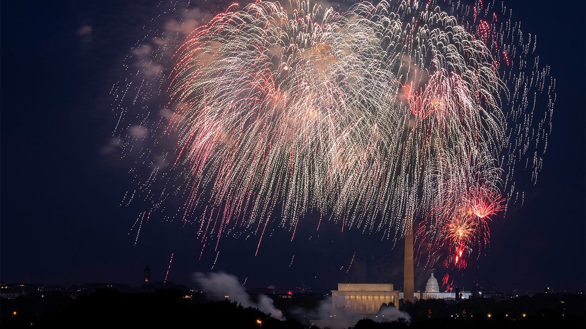 FILE - In this Saturday, July 4, 2020, file photo, Fourth of July fireworks explode over the Lincoln Memorial, the Washington Monument and the U.S. Capitol along the National Mall in Washington. (AP Photo/Cliff Owen, File)
