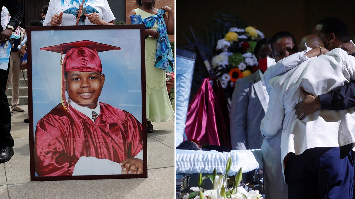 Family and friends embrace Albert Wallace next to the open casket of his son, 10-year-old Justin Wallace, who was shot and killed when a shooter fired rounds at a home on June 5 in the Far Rockaway section of Queens, during his viewing before the funeral at the Full Gospel Tabernacle in New York City, June 21, 2021. 