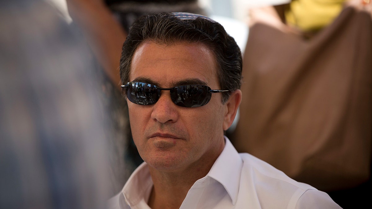 In this July 3, 2016, file photo, Yossi Cohen, then the director of Israel's Mossad intelligence agency, attends the funeral in Jerusalem of a rabbi killed by Palestinian gunmen. Cohen, the outgoing chief of Israel's Mossad intelligence service, offered the closest acknowledgment yet his country was behind a series of recent attacks targeting Iran's nuclear program and a military scientist in a television interview aired Thursday, June 10, 2021. (AP Photo/Oded Balilty, File)