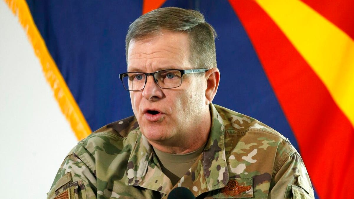 In this May 20, 2020, file photo, then-Arizona National Guard Maj. Gen. Michael McGuire, director of the Department of Emergency and Military Affairs, answers a question at a news conference in Phoenix. McGuire, the former head of the Arizona National Guard, has filed papers to run for the U.S. Senate, joining what's likely to be a crowded field of candidates seeking the Republican nomination. 