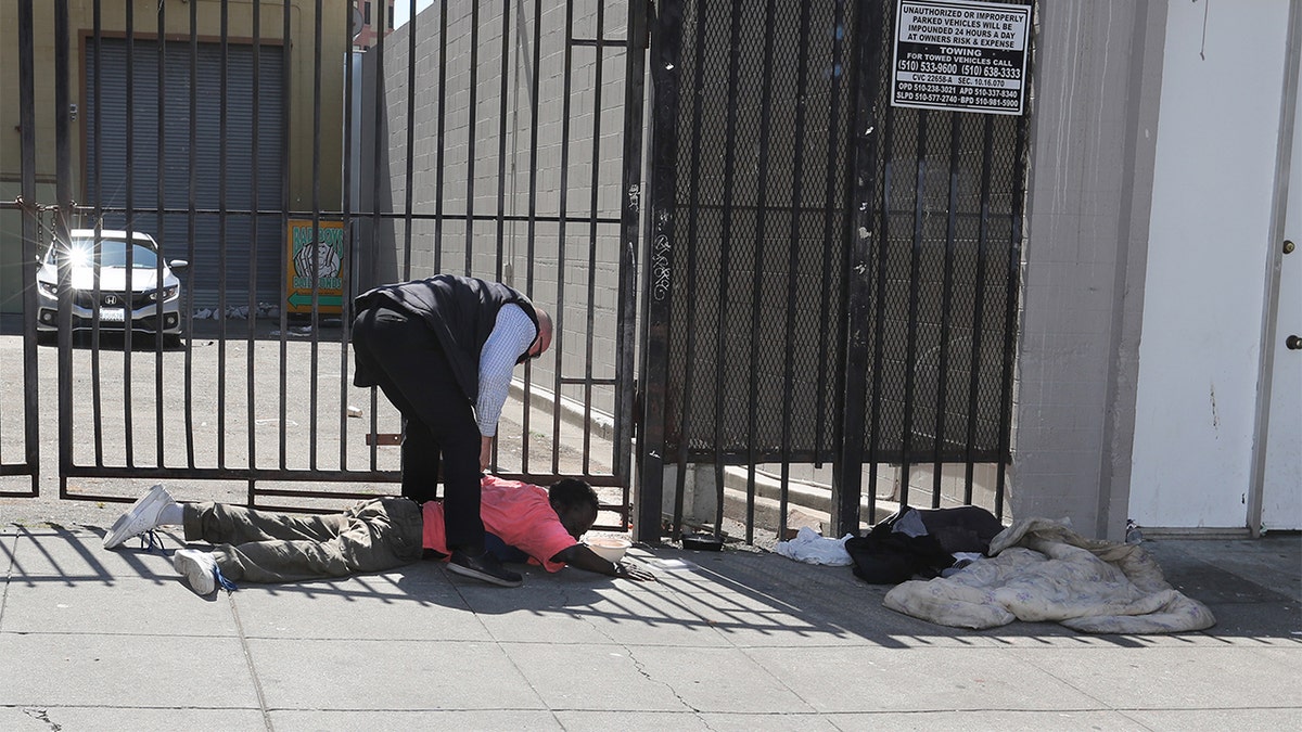 OAKLAND, CA - JUNE 17: One of Governor Newsom's security detail detains a man after he allegedly assaulted the California Governor during a visit to a small business in the seven hundred block of Washington Street in Oakland, Calif., on Thursday, June 17, 2021. "Members of the Governor"u2019s security detail removed the Governor from the situation and the individual was arrested by CHP officers,"u201d the CHP, which provides security for the governor, said in a statement. (Photo by Ray Chavez/MediaNews Group/East Bay Times via Getty Images)